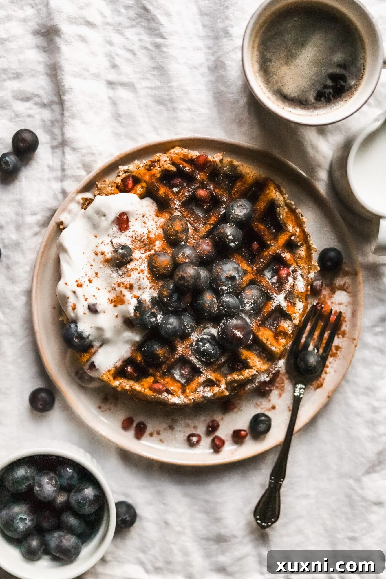plate of sweet potato waffles with blueberries