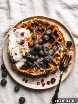 plate of paleo waffles with coconut cream