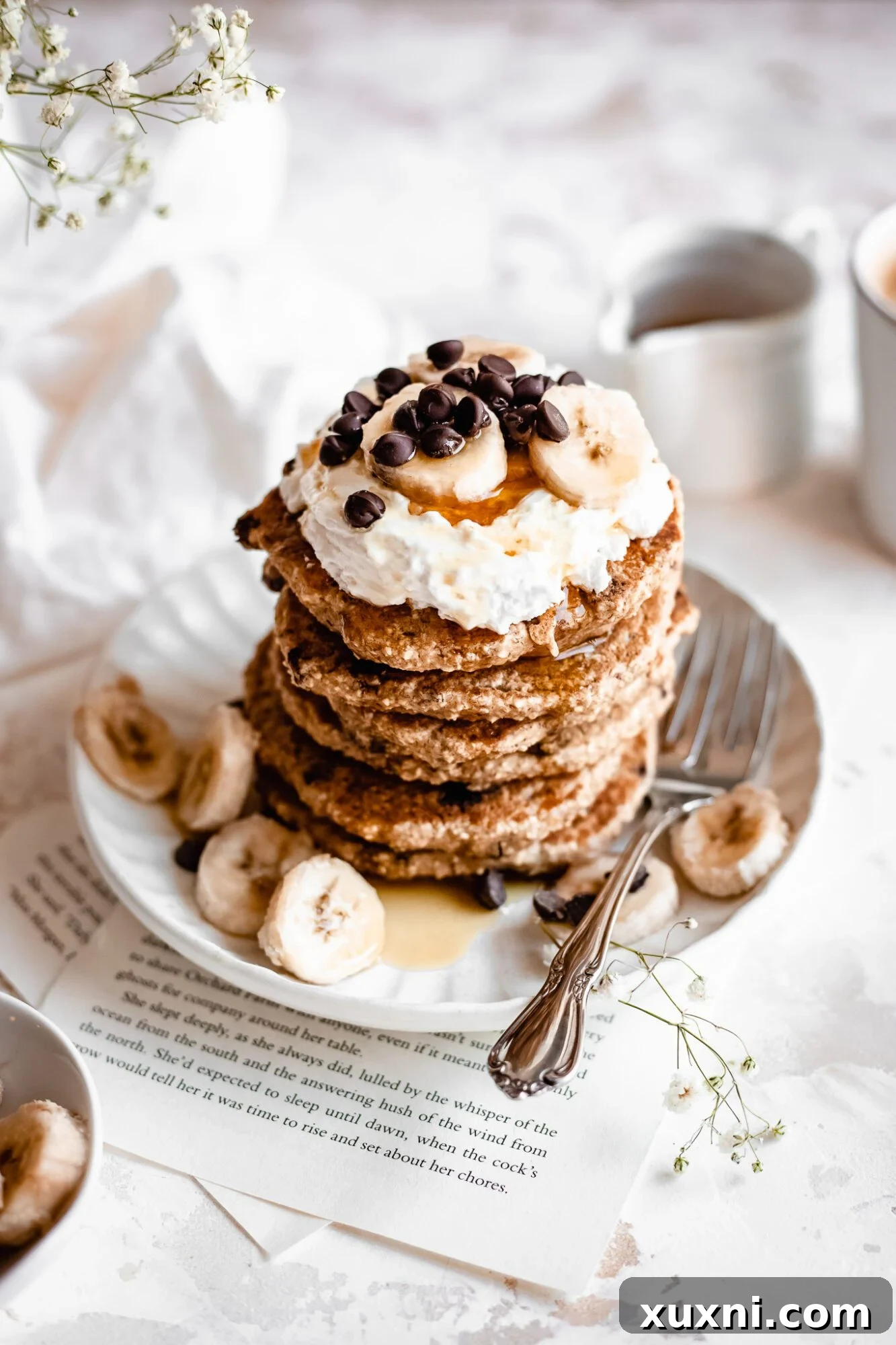 stack of vegan chocolate chip pancakes with maple syrup 