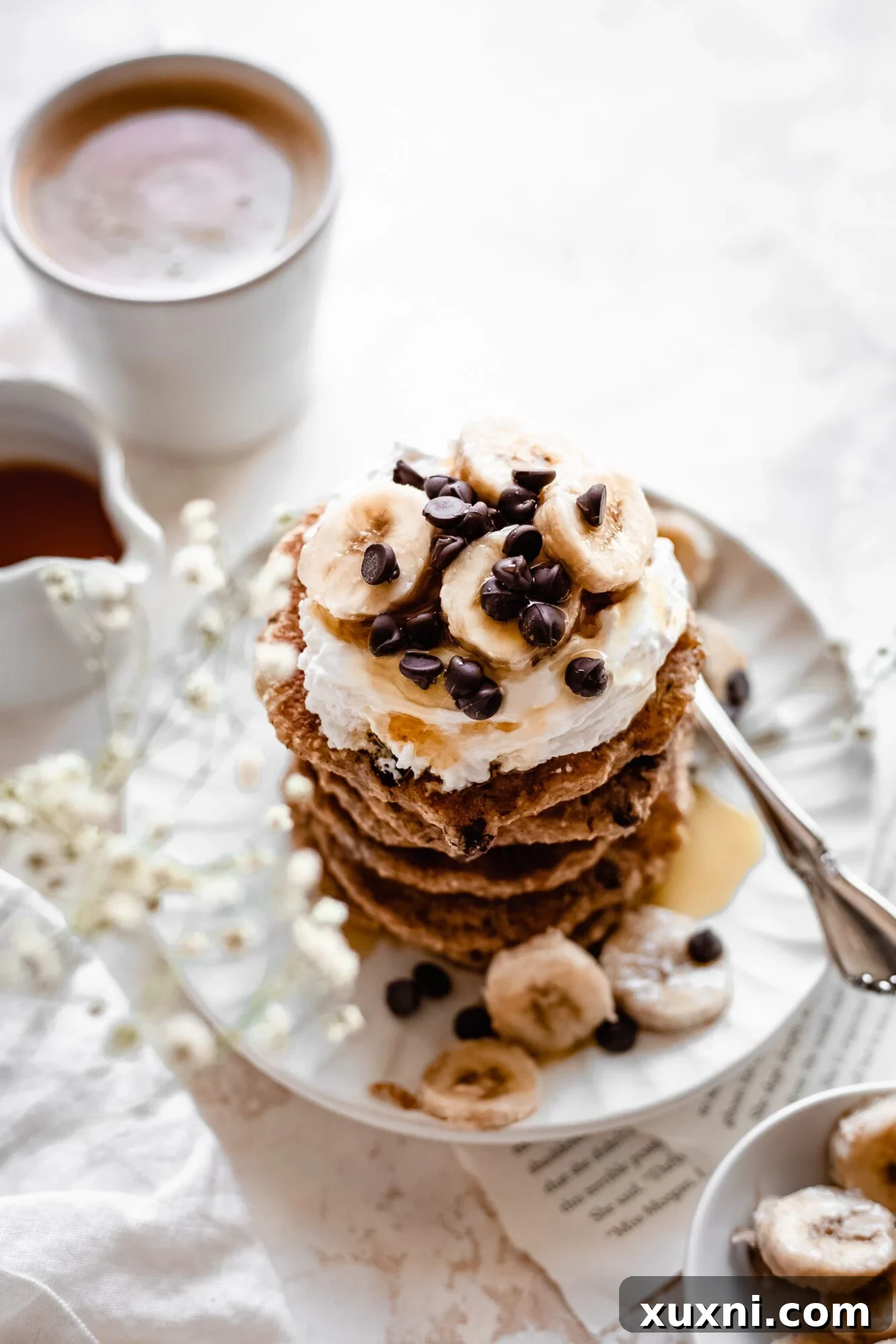 plate of vegan chocolate chip pancakes on white plate