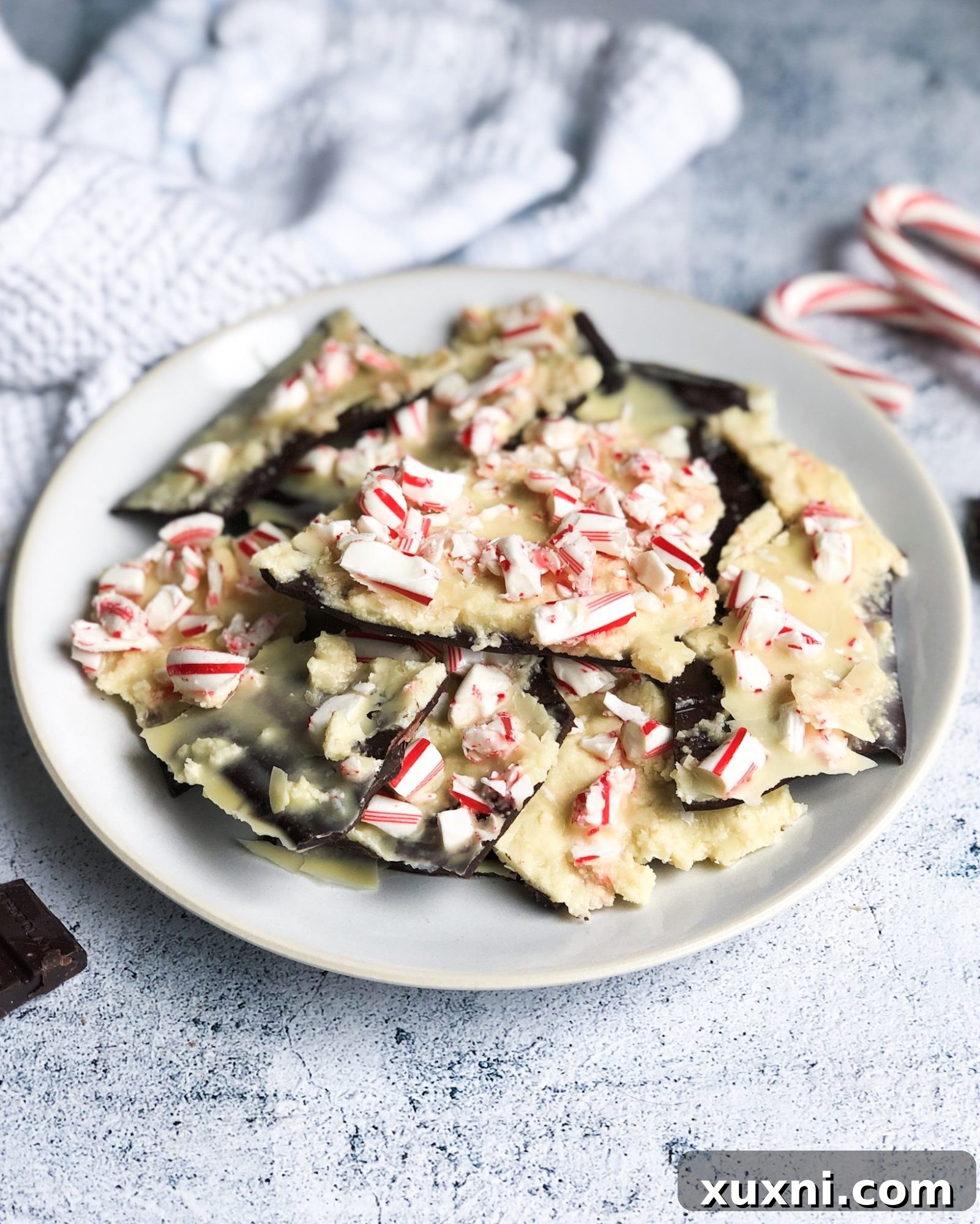 A healthy vegan and paleo peppermint bark made with homemade vegan white chocolate and dark chocolate! The easiest holiday treat everyone will love!