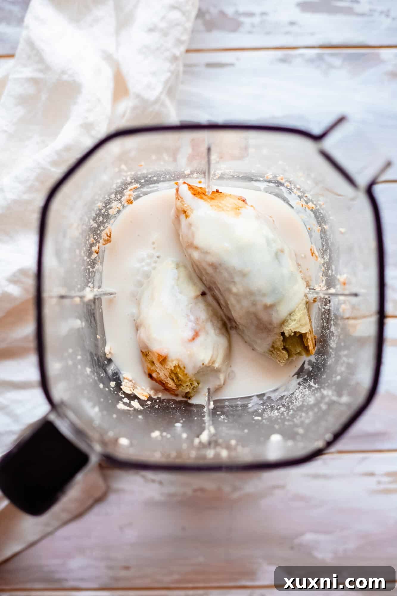 Ingredients for vegan lemon custard filling in a high-speed blender, ready to be processed.