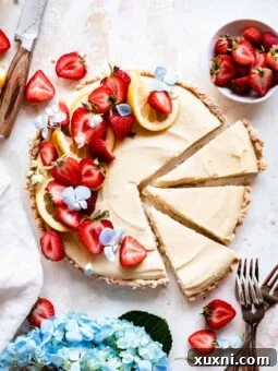 sliced vegan lemon tart with strawberries