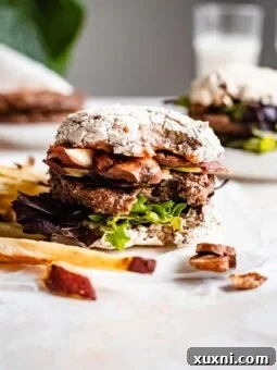 A delicious vegan veggie burger with a bite taken, showing the perfect texture and juicy interior.