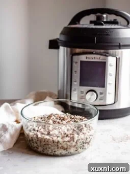 quinoa in meal prep jar next to instant pot
