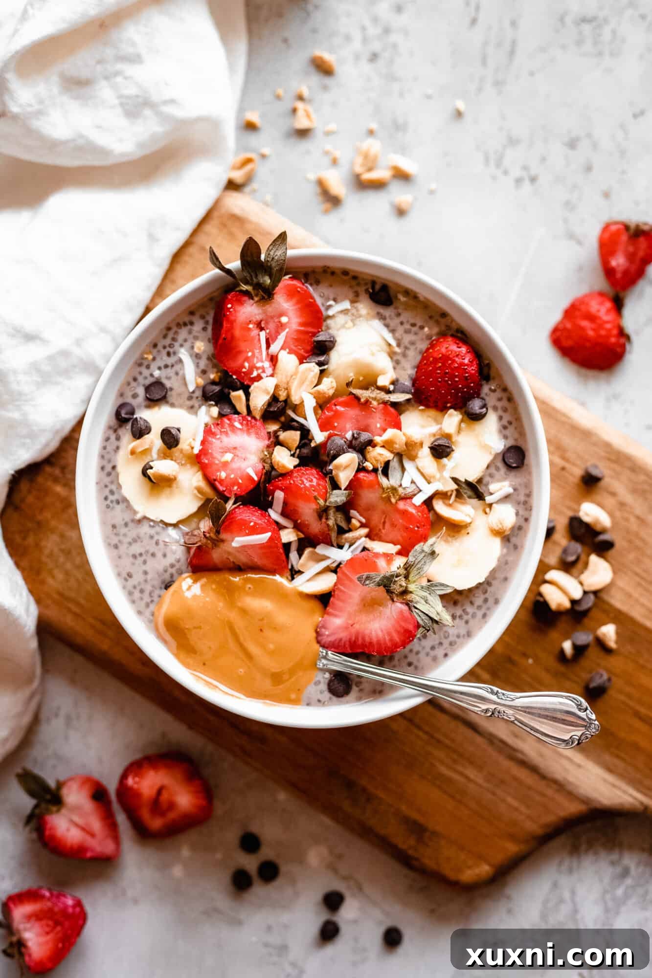Delicious bowl of banana chia pudding topped with fresh fruit