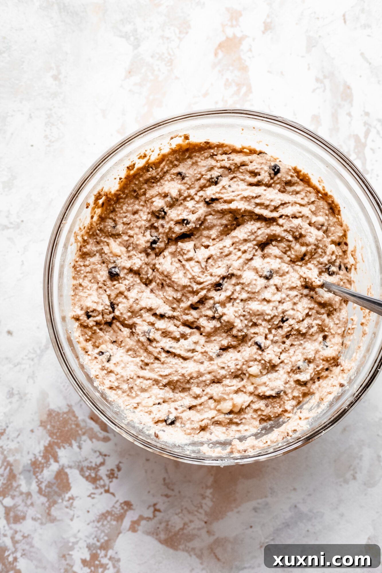 Mixed chocolate chip peanut butter muffin batter in a bowl