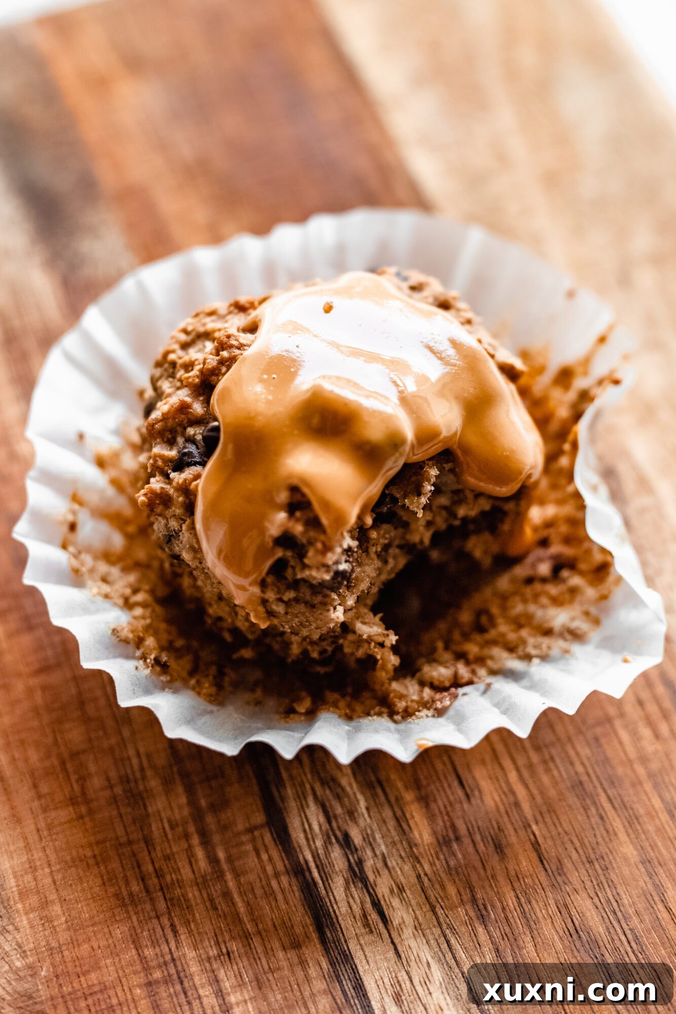 Close-up of a peanut butter muffin with a swirl of peanut butter on top