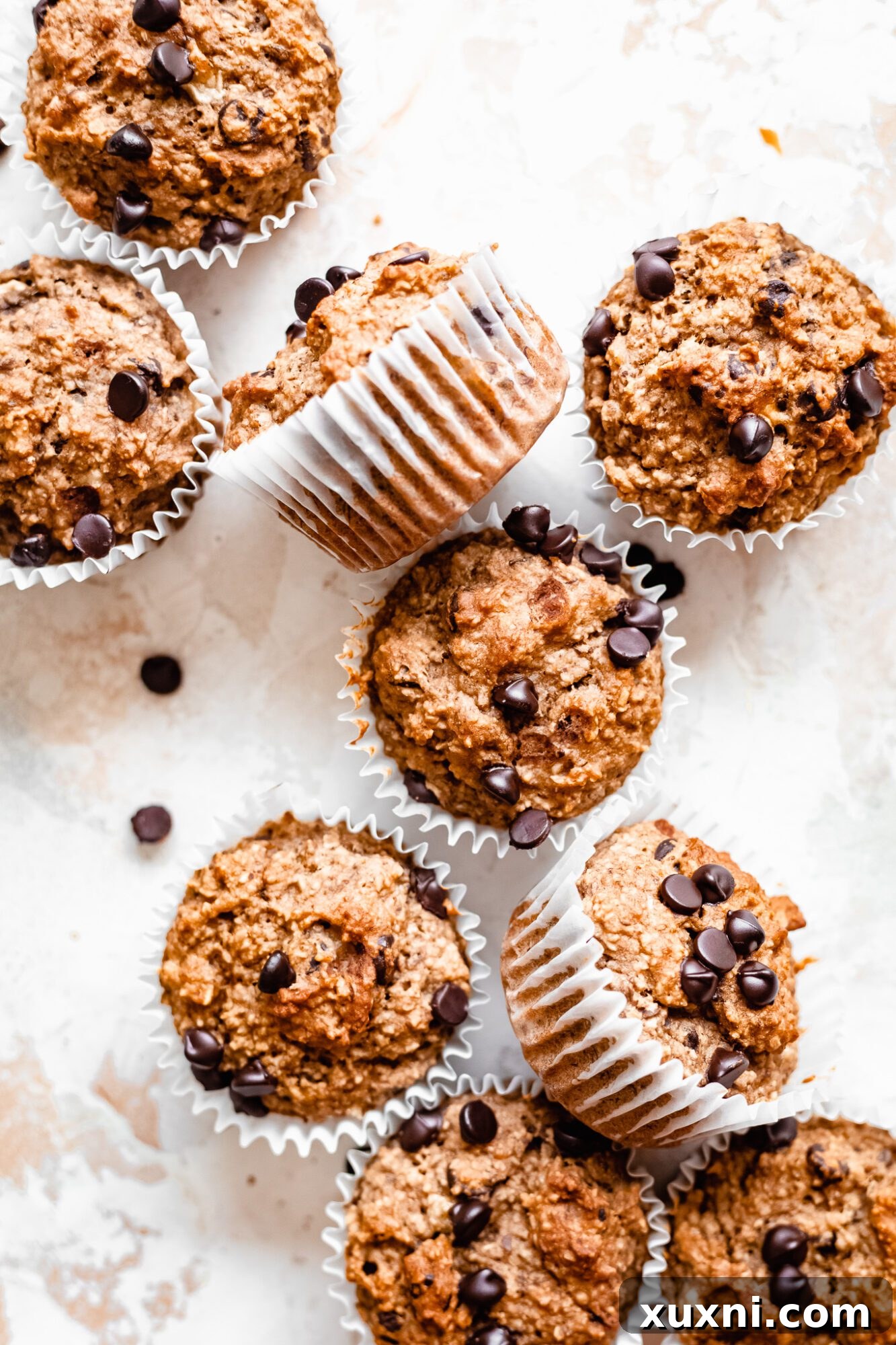 Banana muffin ingredients all mixed up on a wooden board