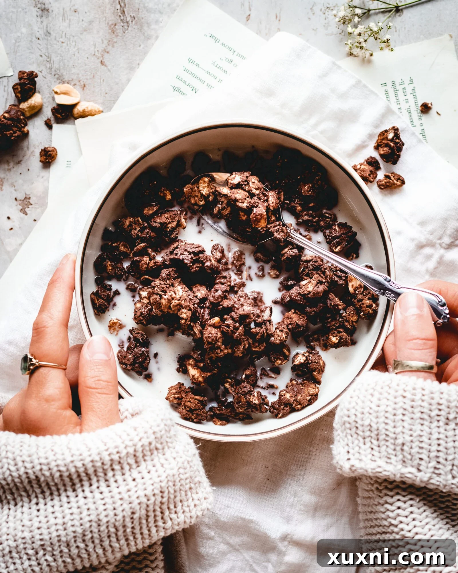 hands hold bowling of granola