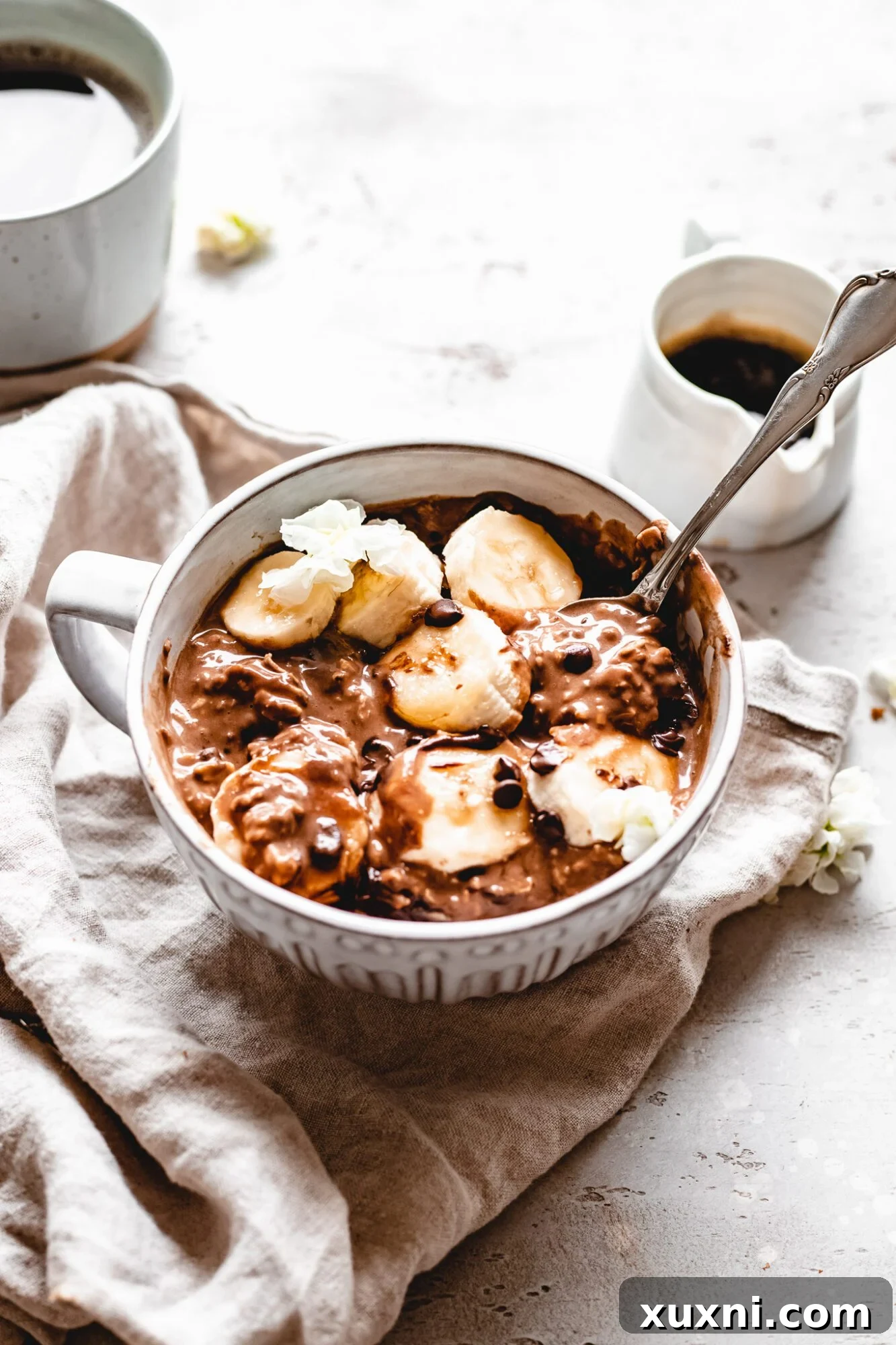 bowl of vegan overnight oats with espresso being poured in