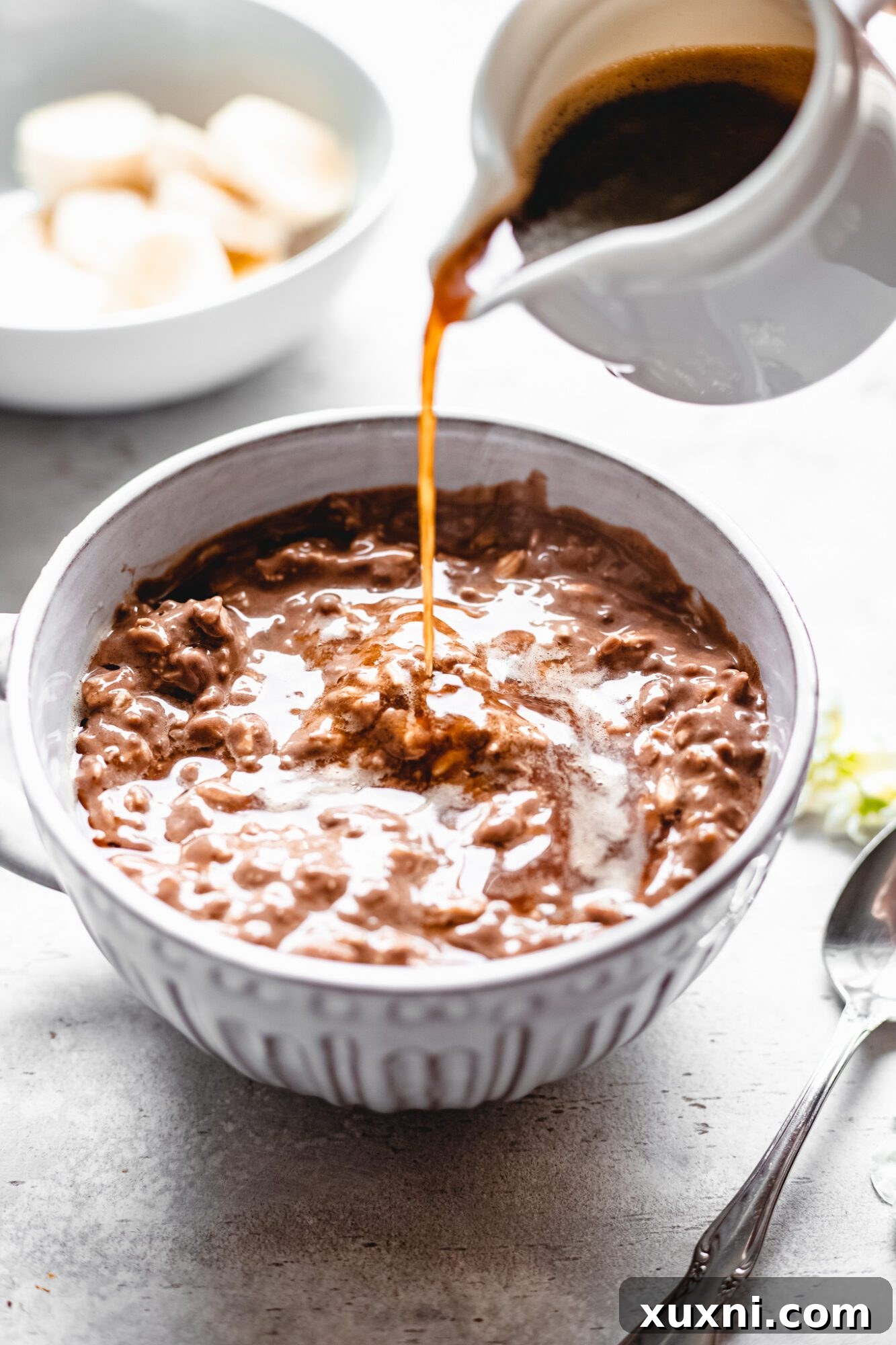 espresso being poured over vegan chocolate oats