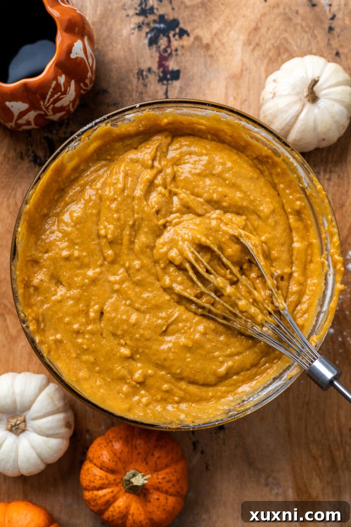 One-bowl pumpkin cake batter showing its rich, smooth consistency, ready for baking.
