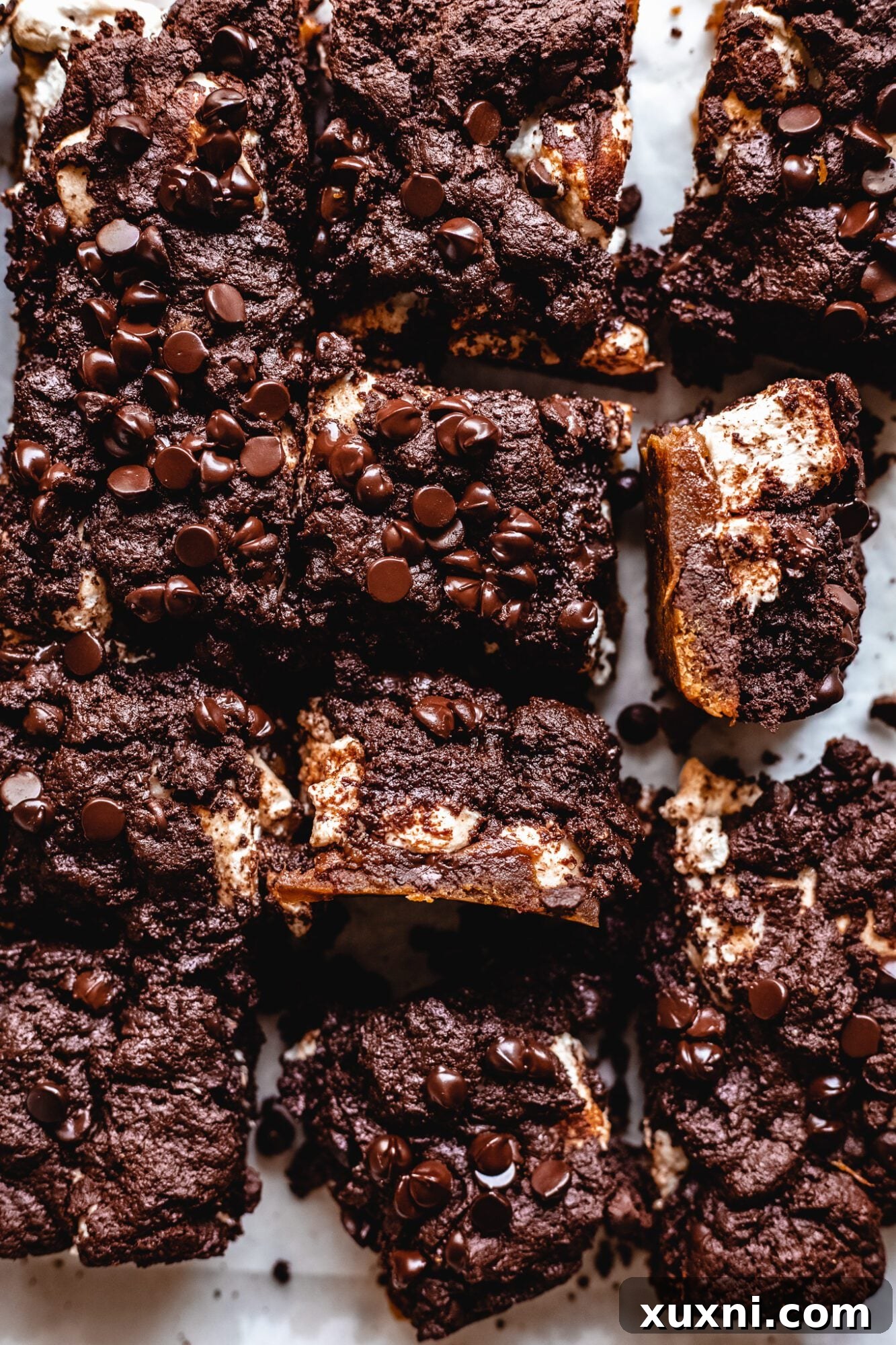 Vegan Smores Brownie Cookie Recipe 12 close up of a slice of vegan s'mores brookie, showing the distinct layers and gooey marshmallow