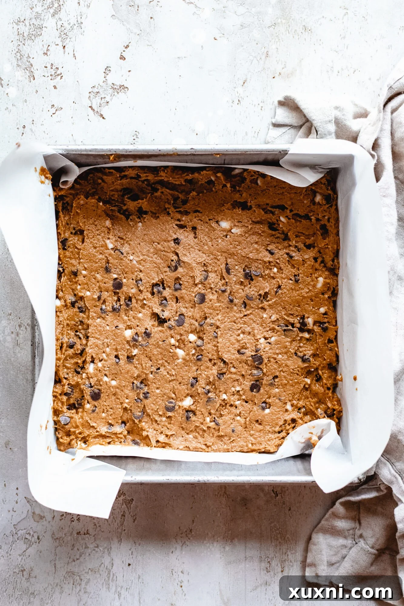 Vegan Smores Brownie Cookie Recipe 7 vegan cookie dough pressed into the bottom of a square baking pan