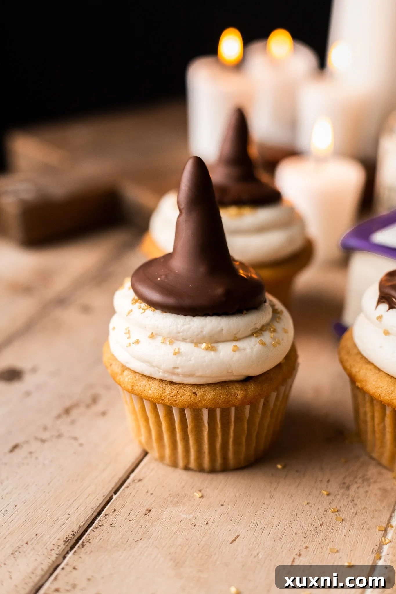 sorting hat cupcakes on wooden table 