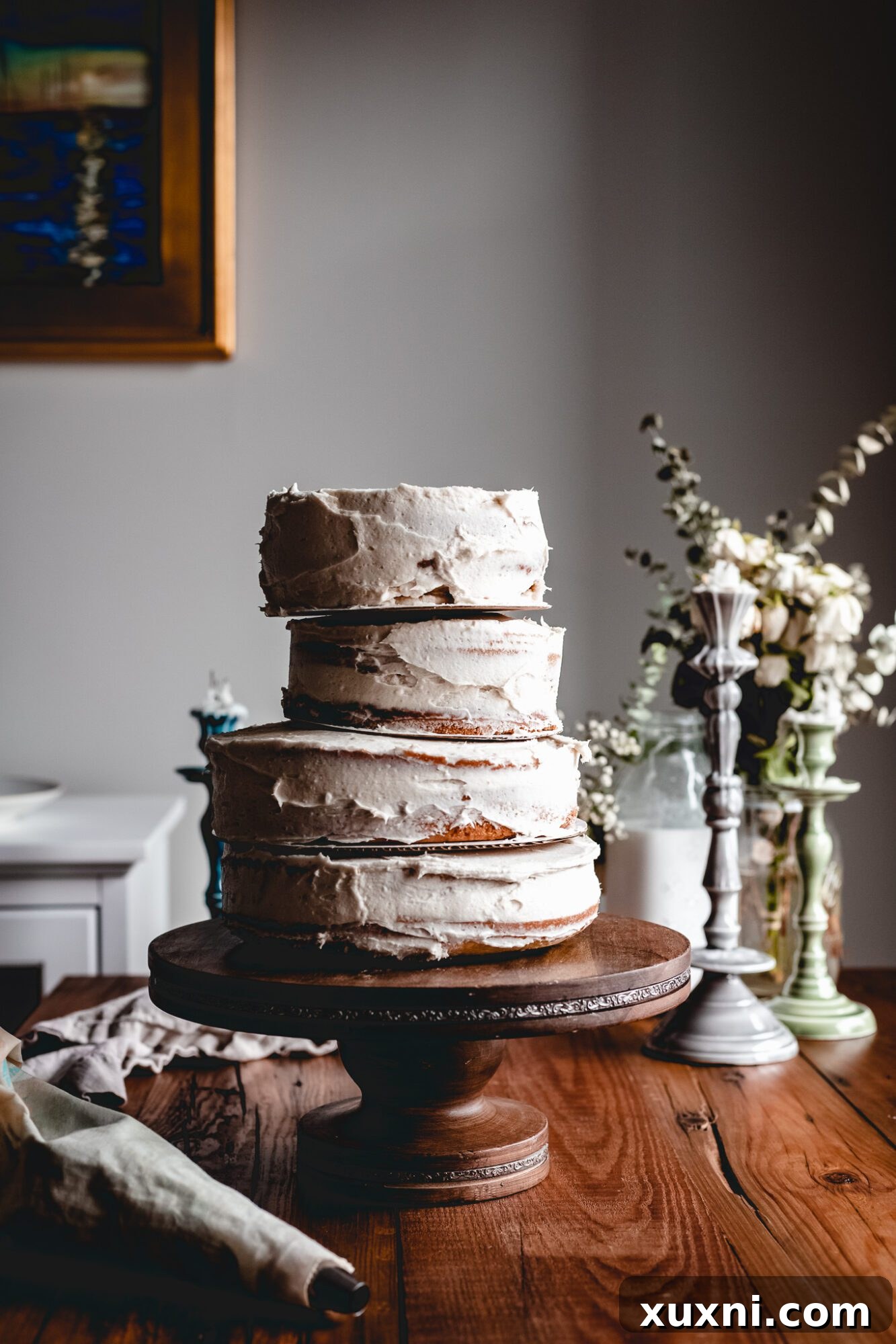 The stacked tiers of the vegan Sleeping Beauty birthday cake, showcasing the whimsical, slightly tilted arrangement.