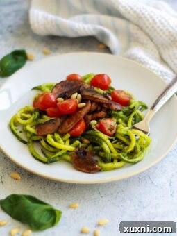 These paleo vegan pesto zoodles are the perfect alternative if you're following Whole30 or want a new way to eat veggie pasta! The pesto is easy, delicious, and will become a family favorite!