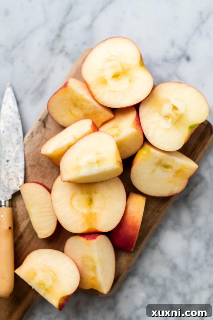 Freshly chopped apples ready for blending, illustrating the minimal preparation needed before processing.