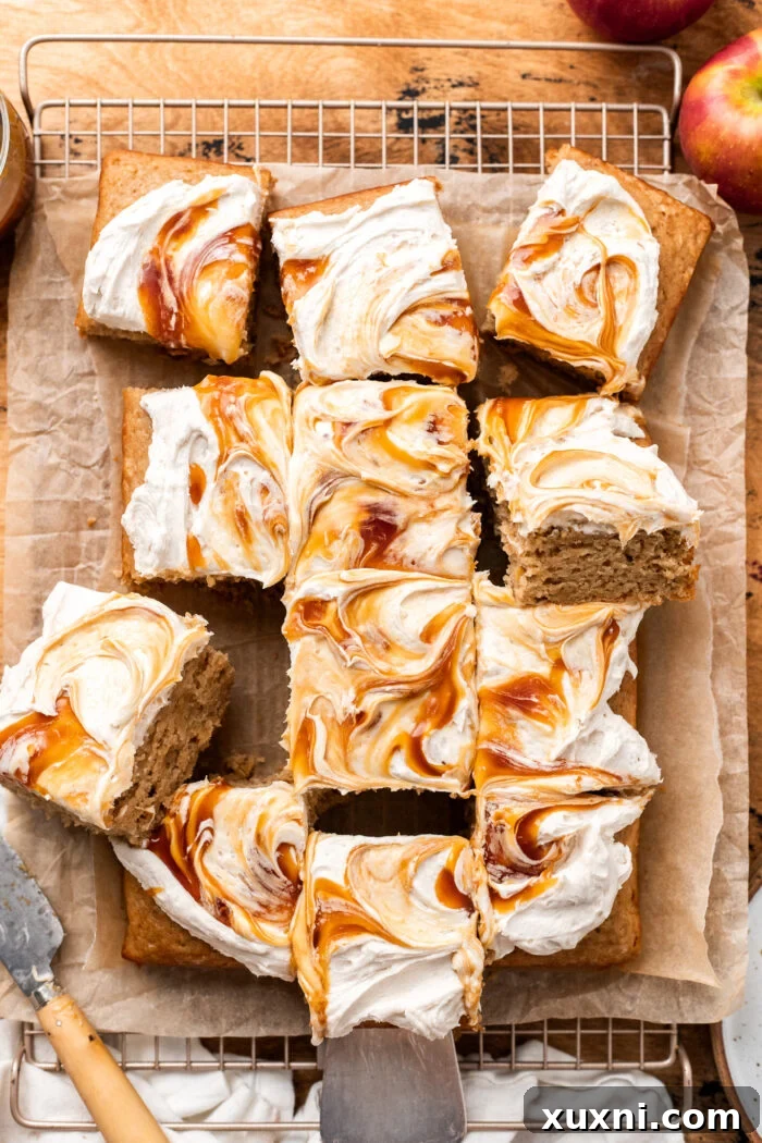 Perfectly cut slices of vegan apple spice cake on a serving plate, highlighting its moist texture and inviting appeal.