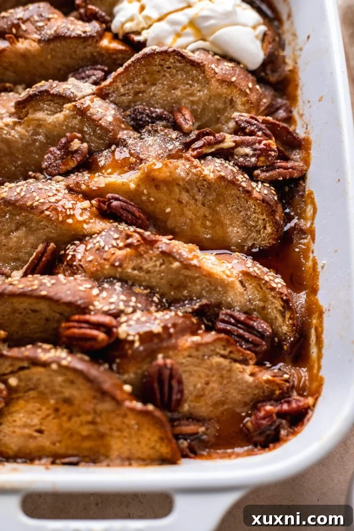 Close-up shot of a baked vegan French toast casserole, showcasing its soft, custardy interior.