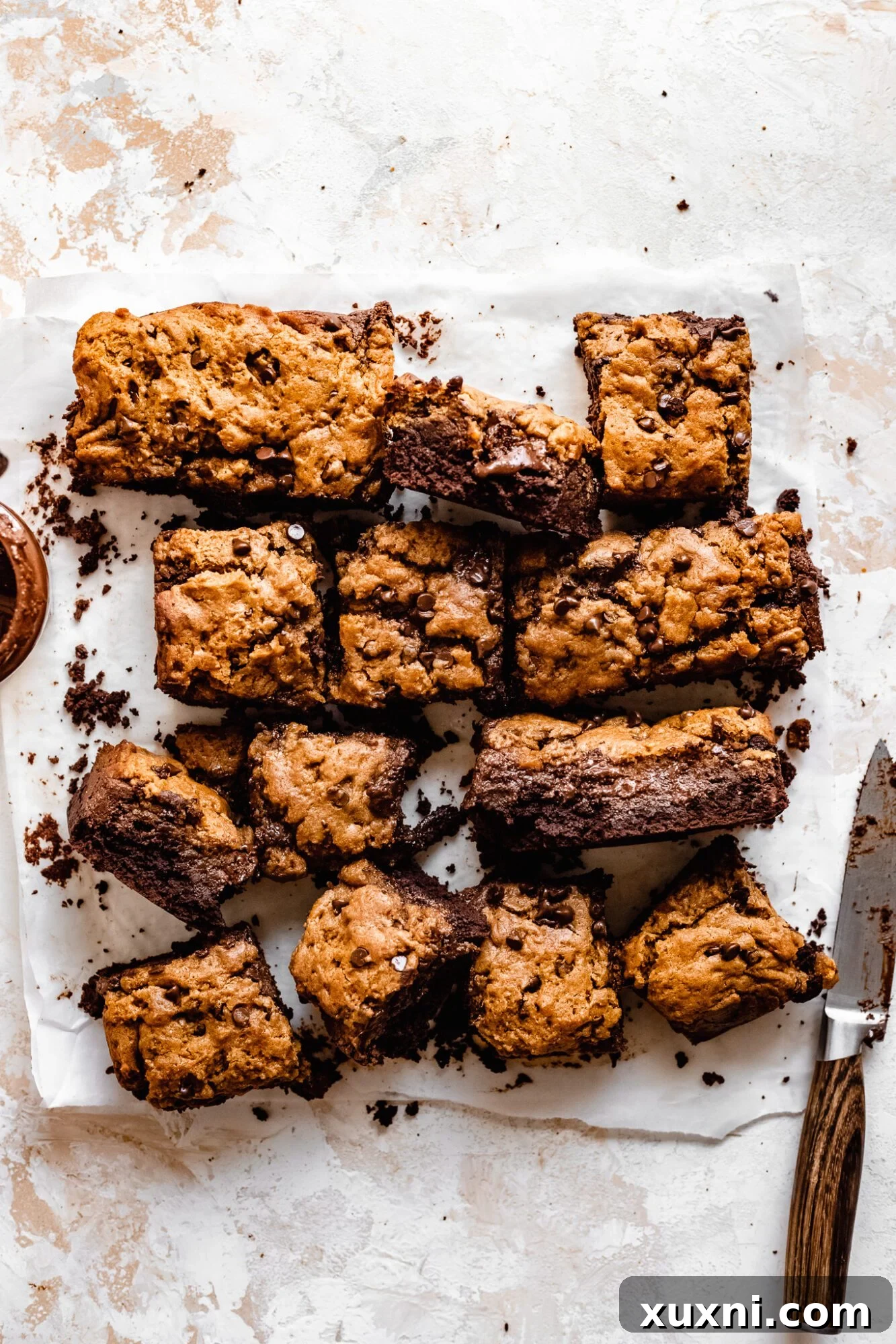 Perfectly sliced vegan brookie bars revealing gooey Nutella filling