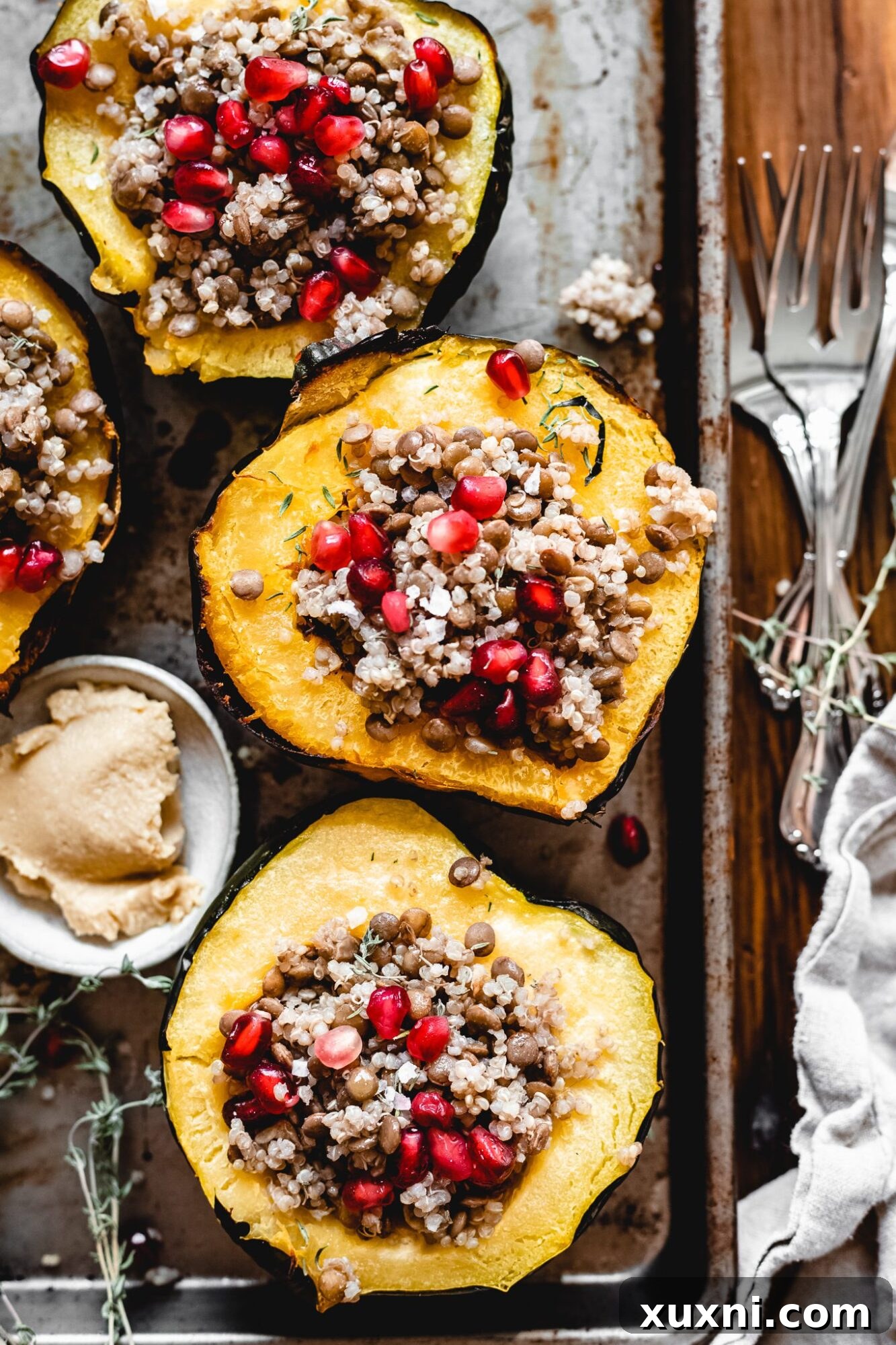 Plant-Powered Lentil Quinoa Stuffed Acorn Squash 2 Vegan Lentil and Quinoa Stuffed Acorn Squash on baking sheet