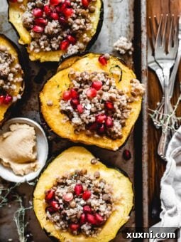 Vegan Lentil and Quinoa Stuffed Acorn Squash on baking sheet