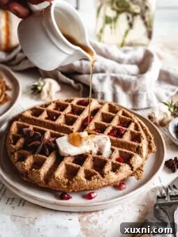 maple syrup drizzled onto pumpkin waffles