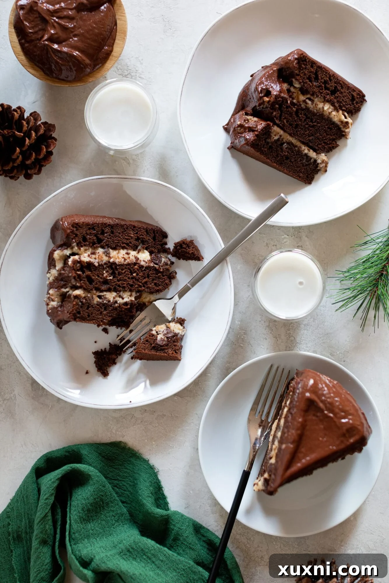 Several slices of vegan cookie dough cake arranged on a platter