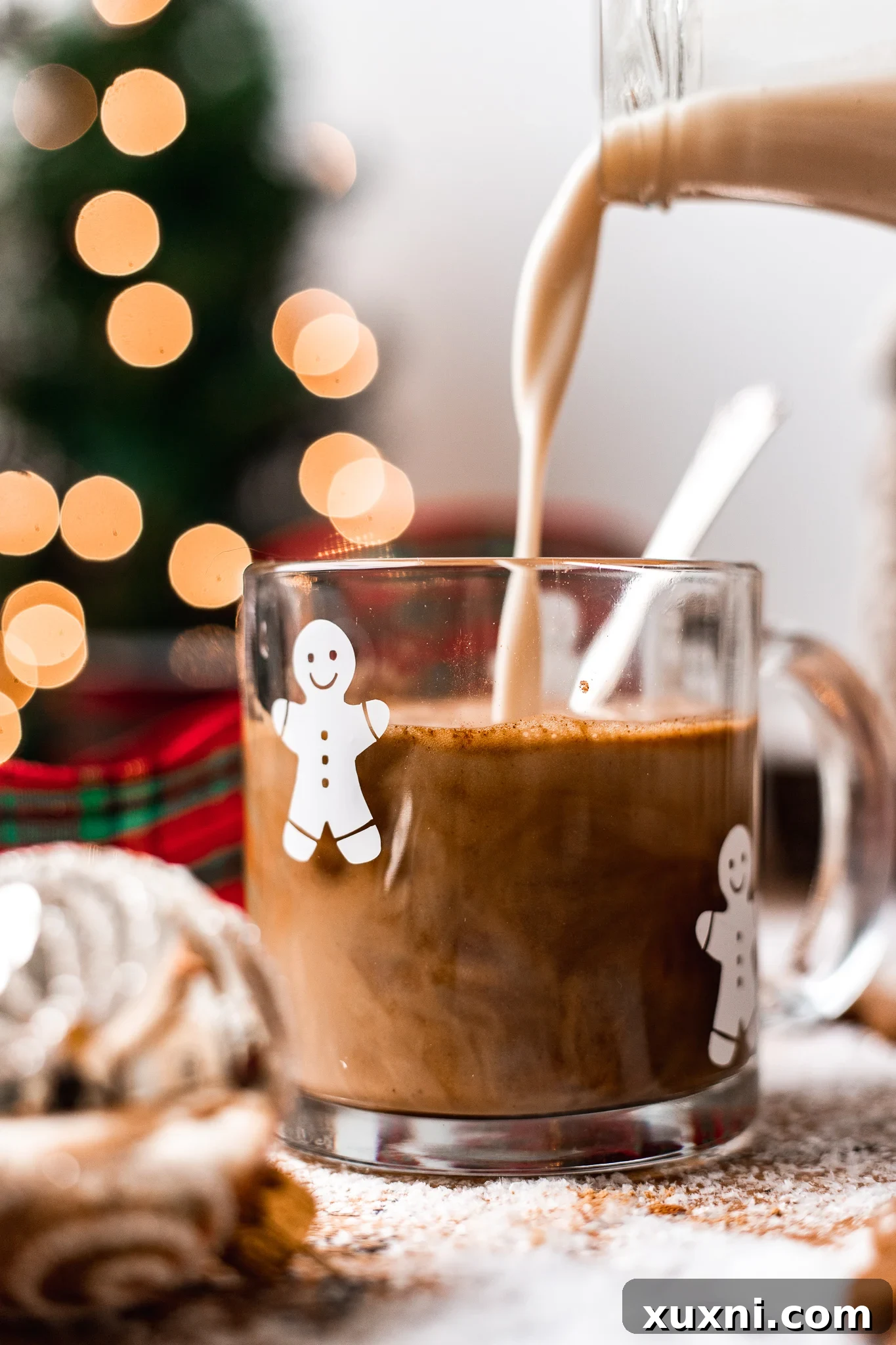 adding steamed milk to espresso