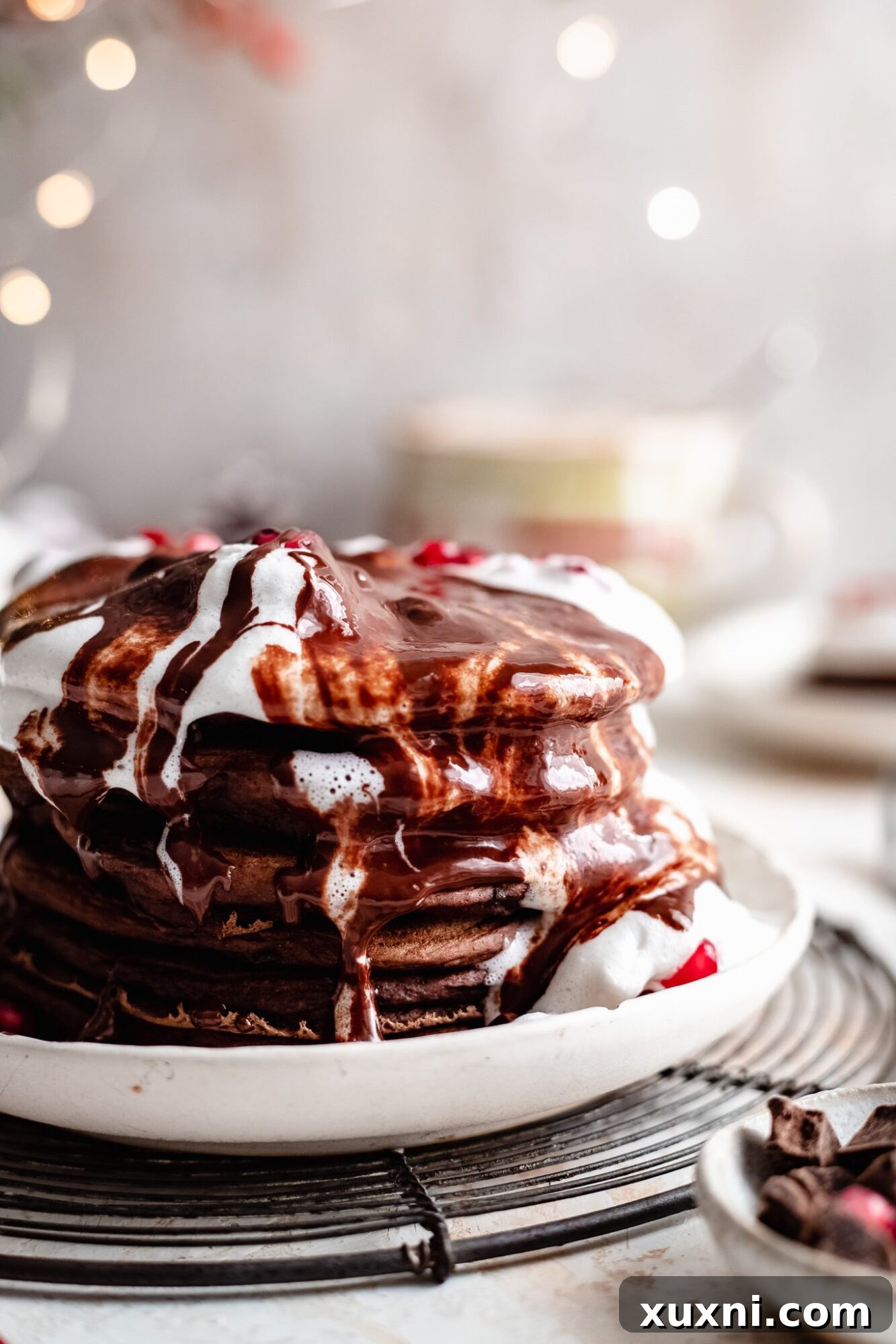 Stack of hot vegan chocolate pancakes ready to be served.
