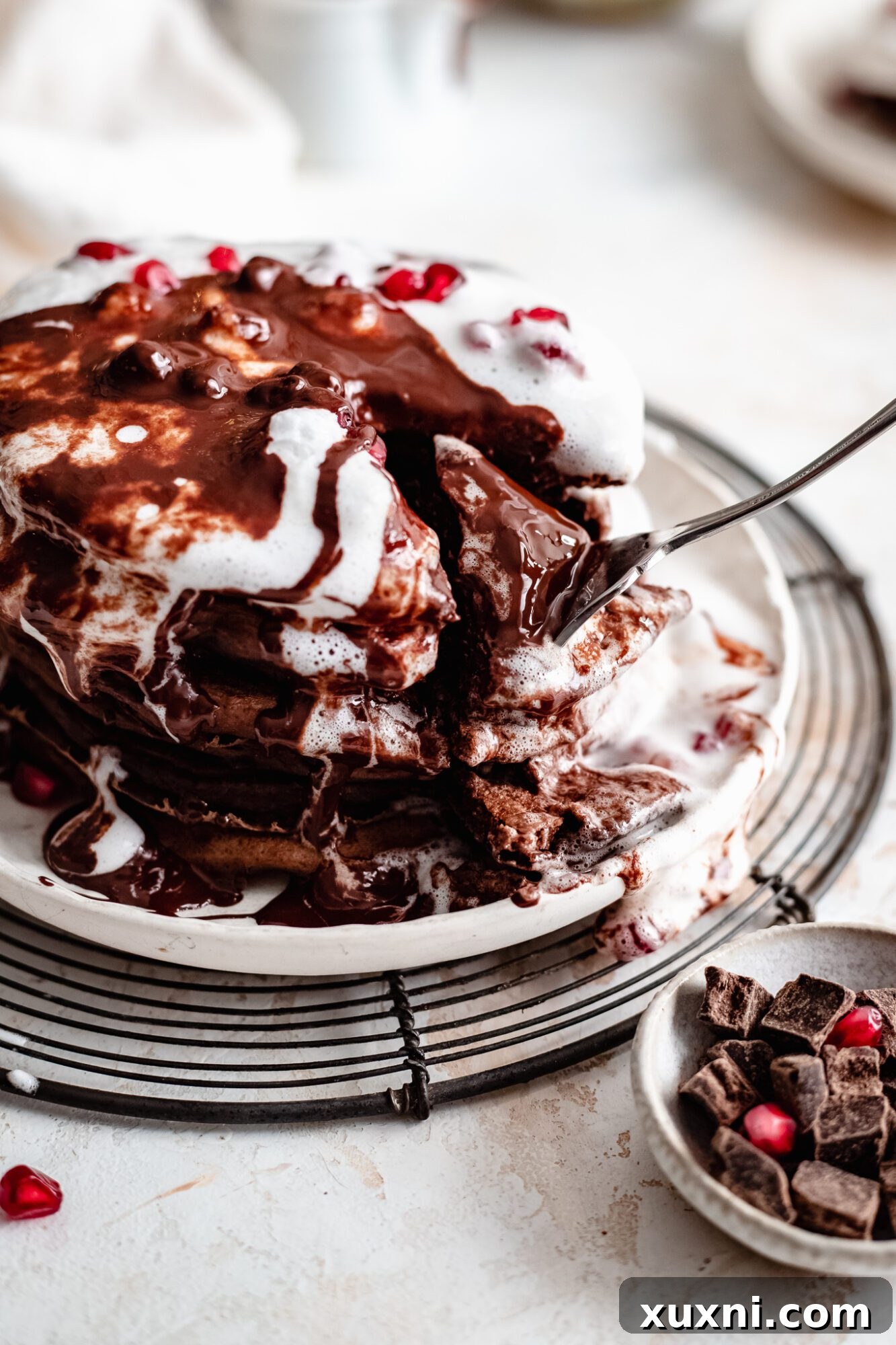 Sliced vegan chocolate pancakes showing their fluffy interior.