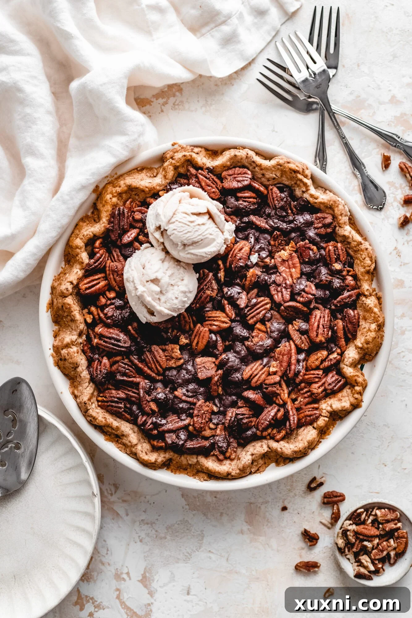 Gooey and rich vegan chocolate pecan pie, perfect for Thanksgiving