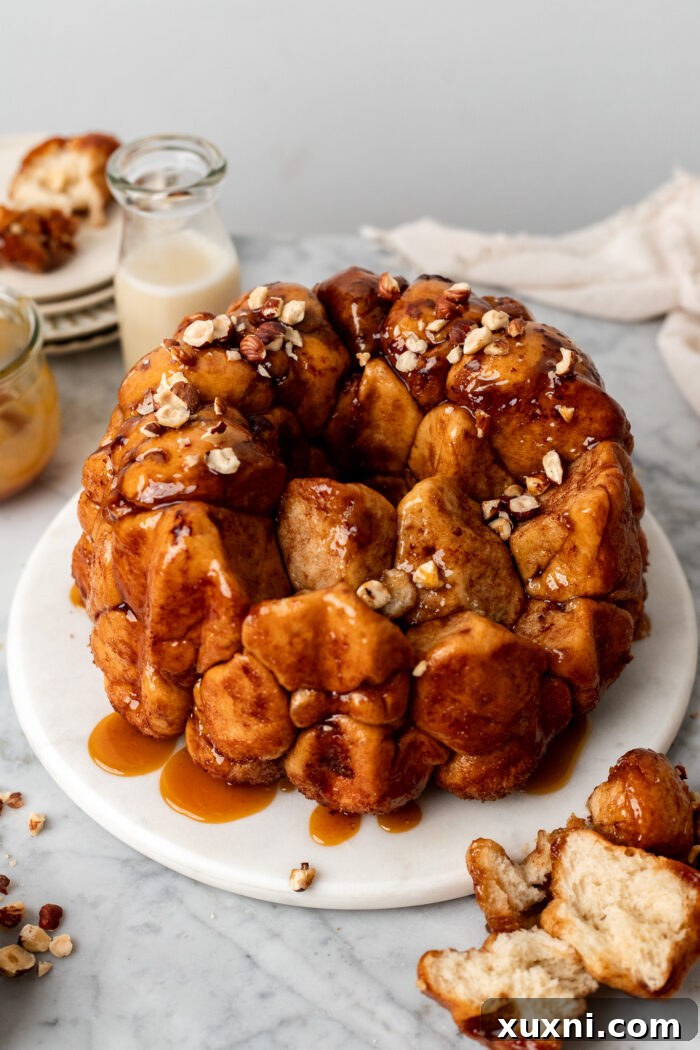 The Ultimate Easy Vegan Pull-Apart Bread 15 A freshly baked vegan monkey bread being pulled apart, showing its soft interior.