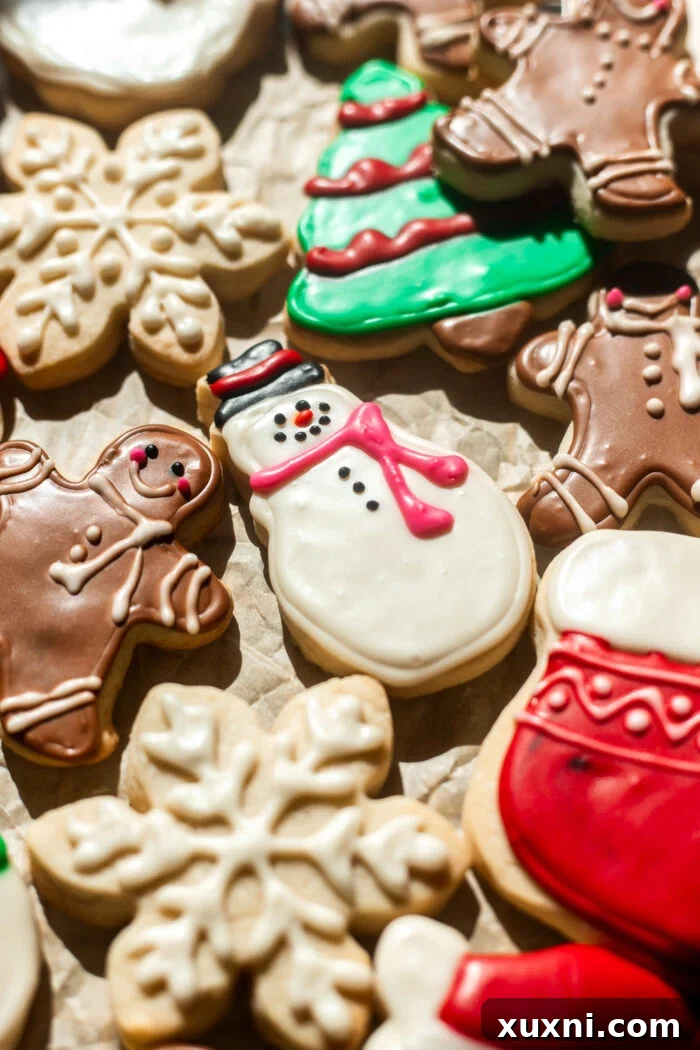 Assortment of beautifully decorated vegan sugar cookies with colorful royal icing.