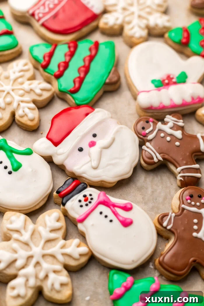 Close up of a decorated Santa sugar cookie with vegan royal icing