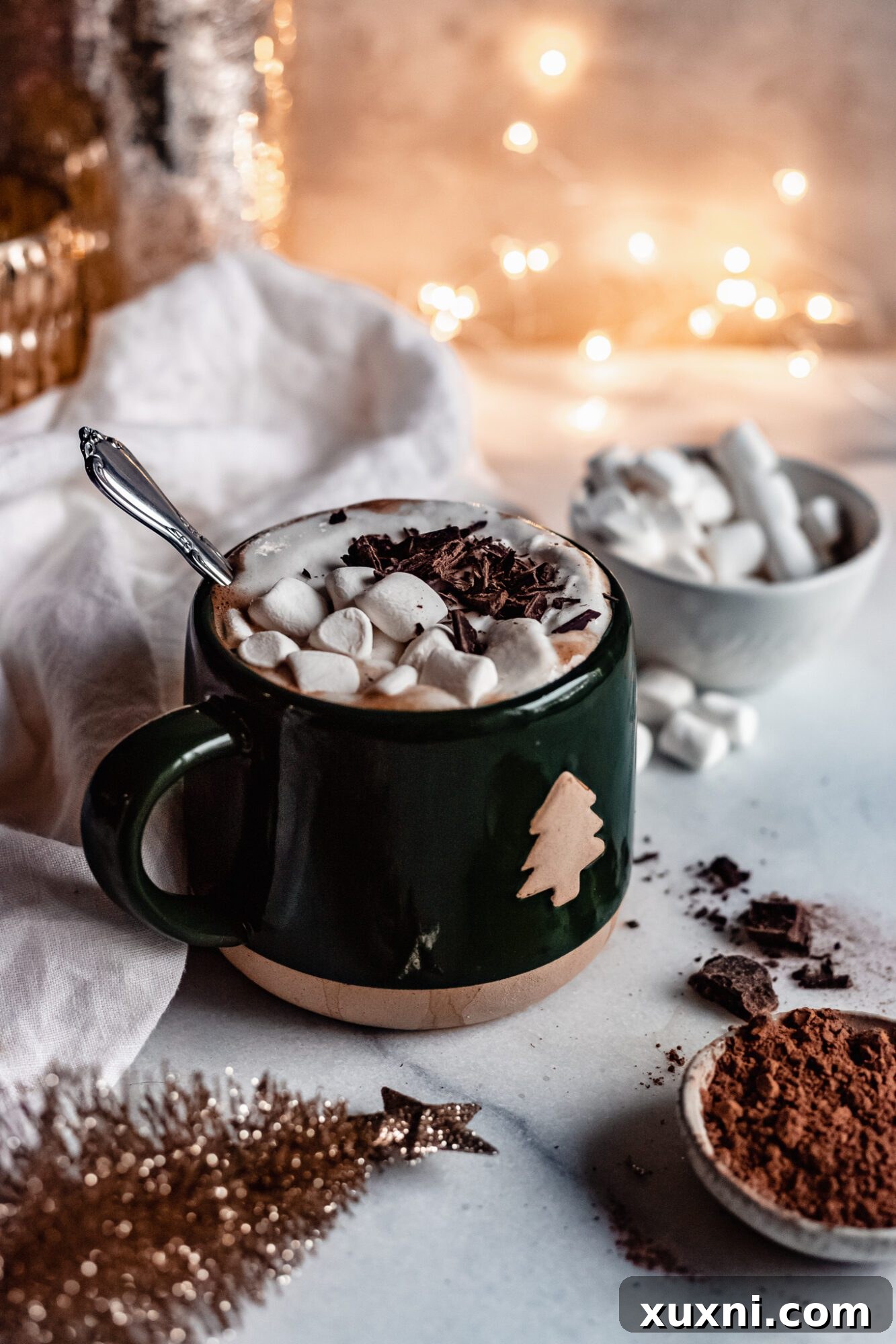 Homemade vegan peppermint mocha, garnished with whipped cream and chocolate shavings.