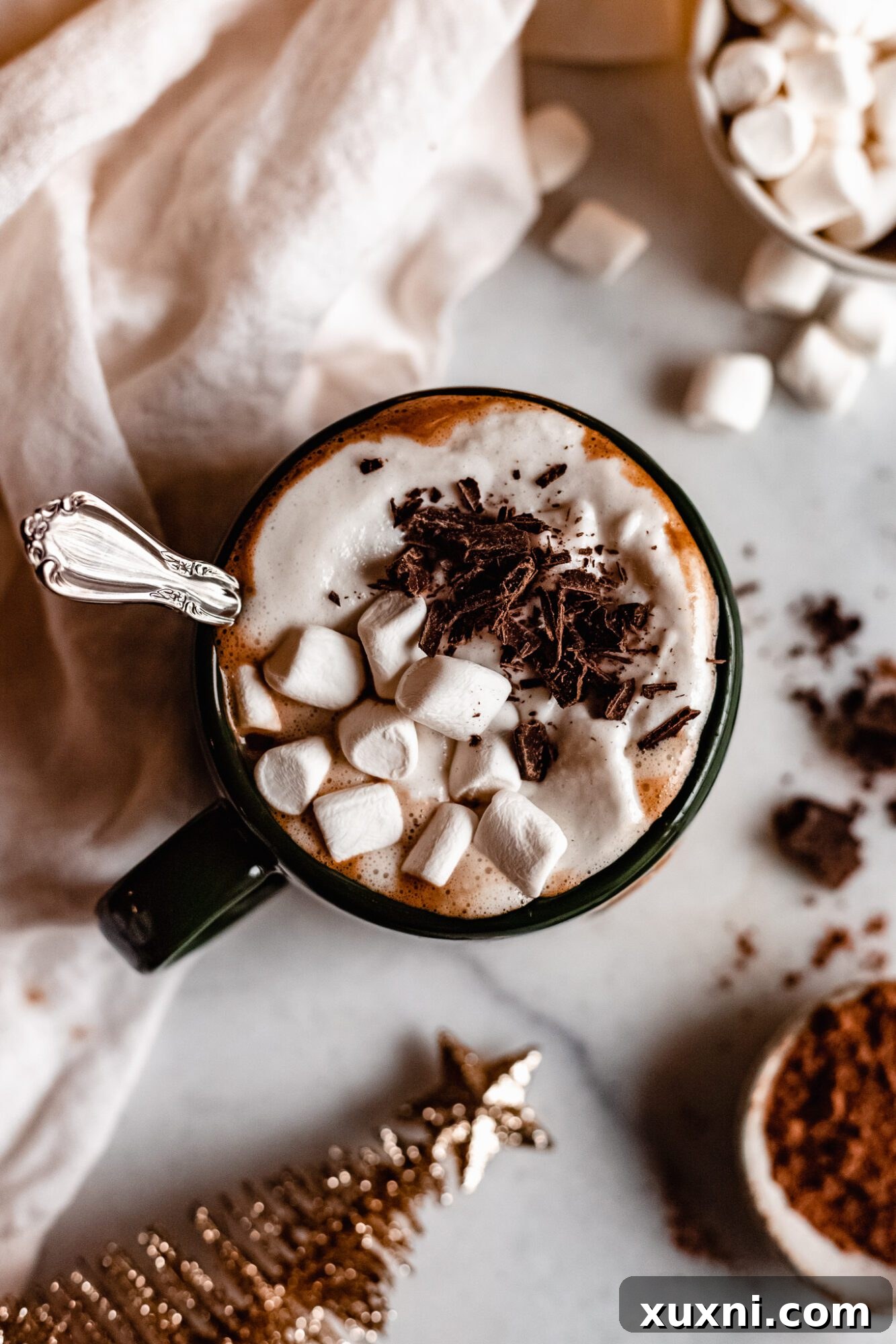 Vegan peppermint mocha topped generously with whipped cream and chocolate.