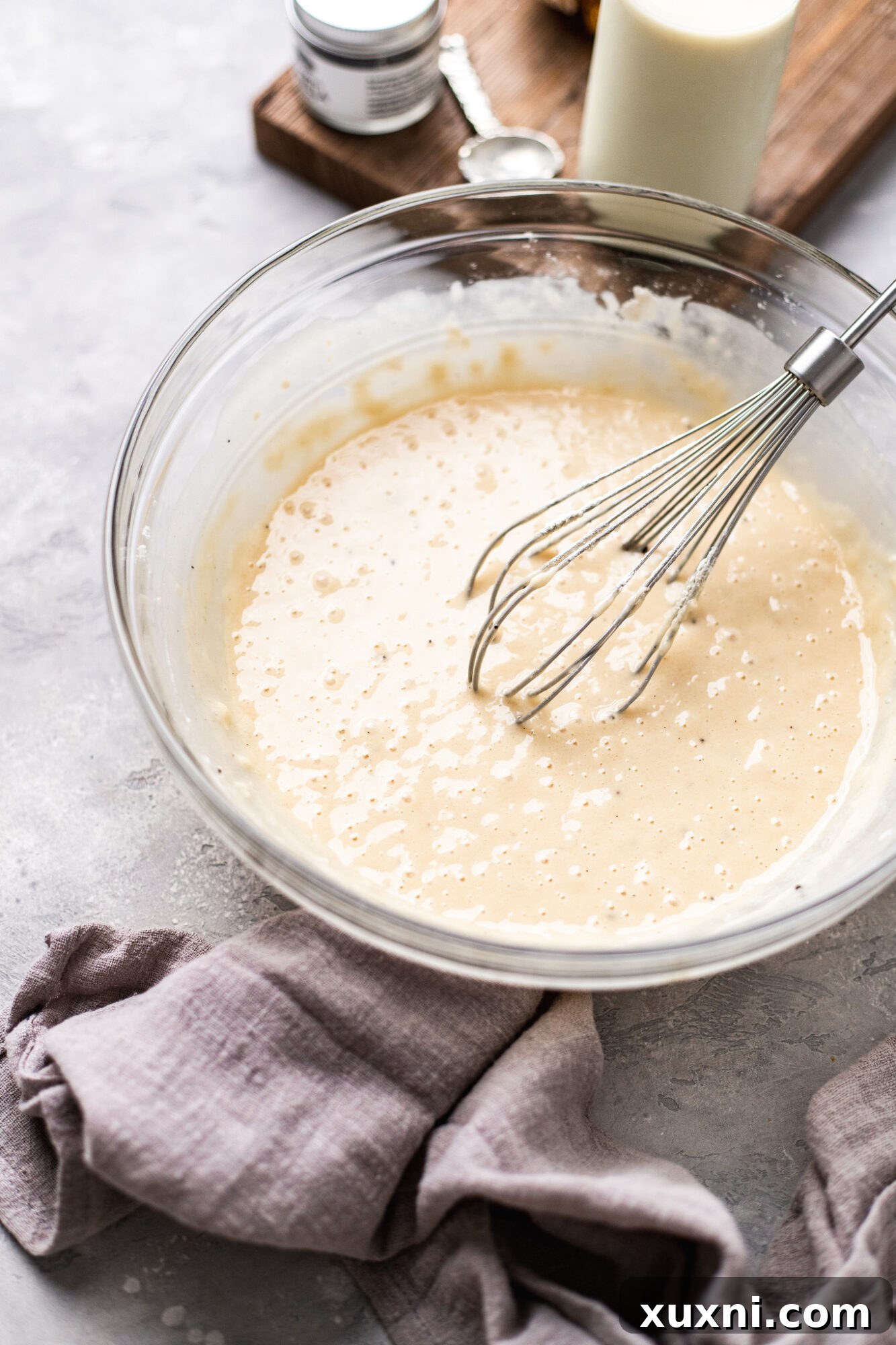 Close-up of fluffy white chocolate cupcake batter in a bowl