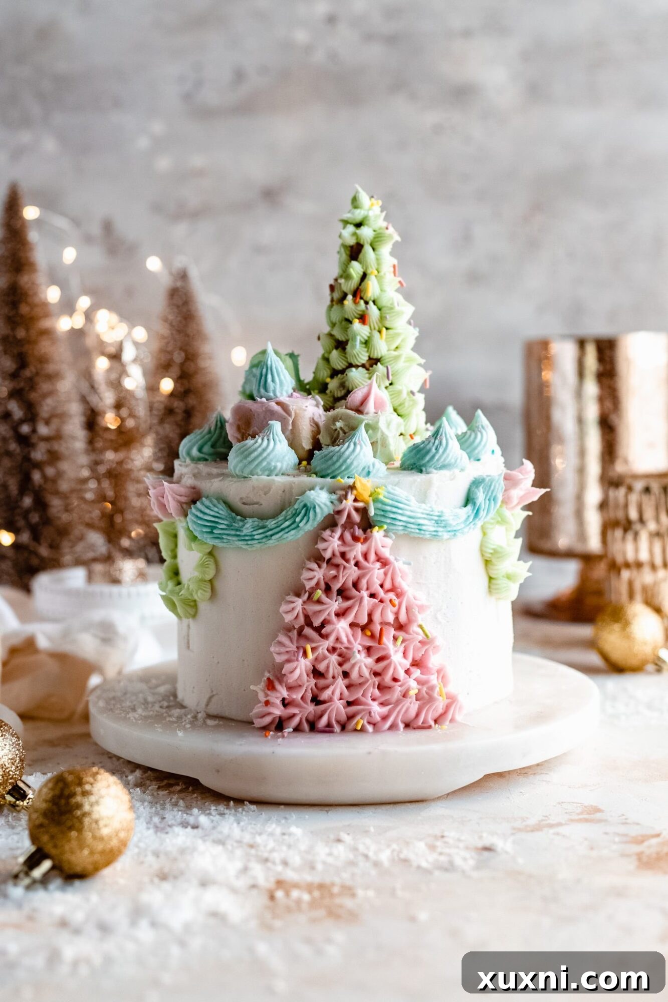 Close-up of vegan Christmas cake with gifts and tree