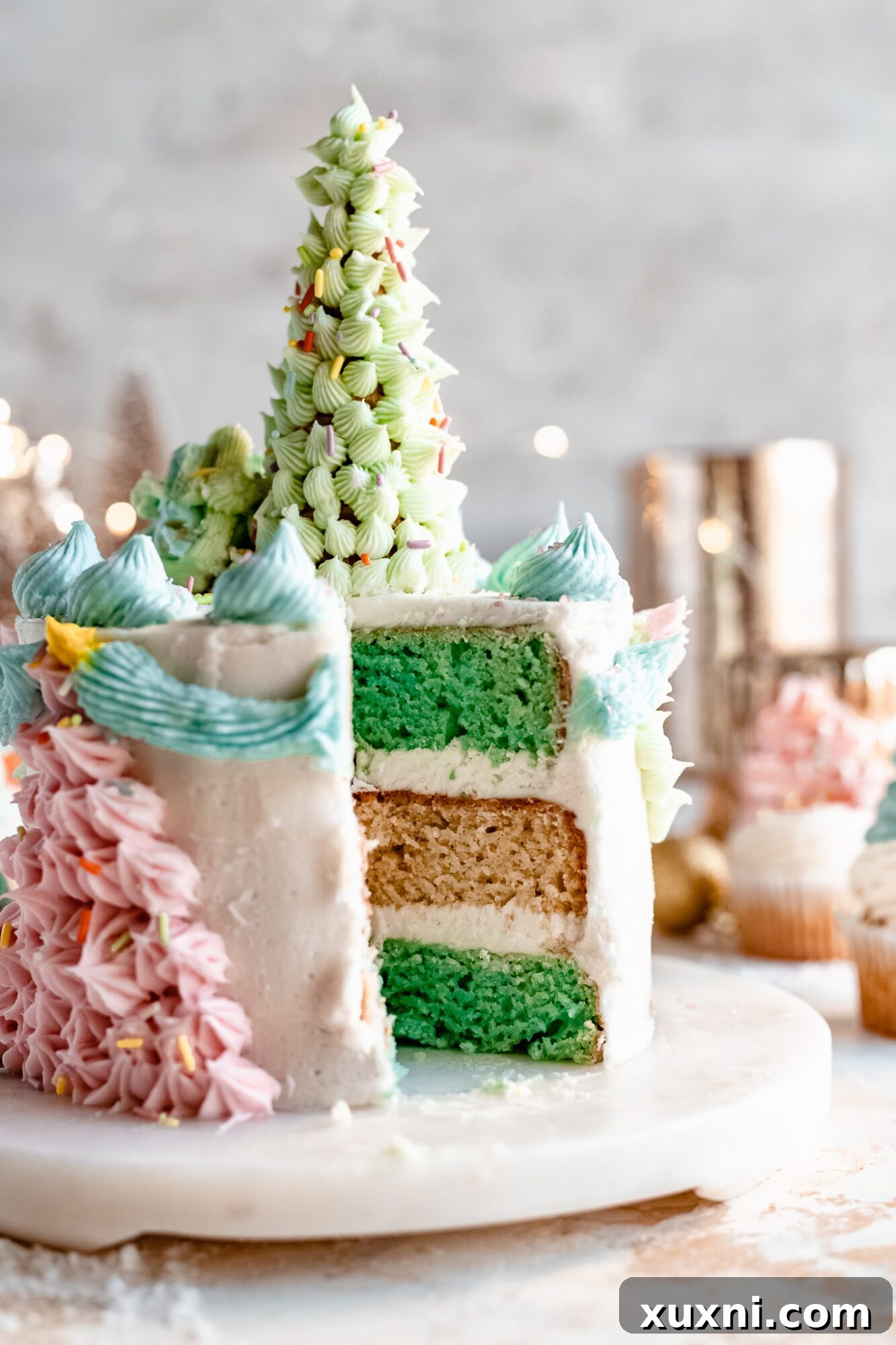 Layered vegan holiday cake being frosted