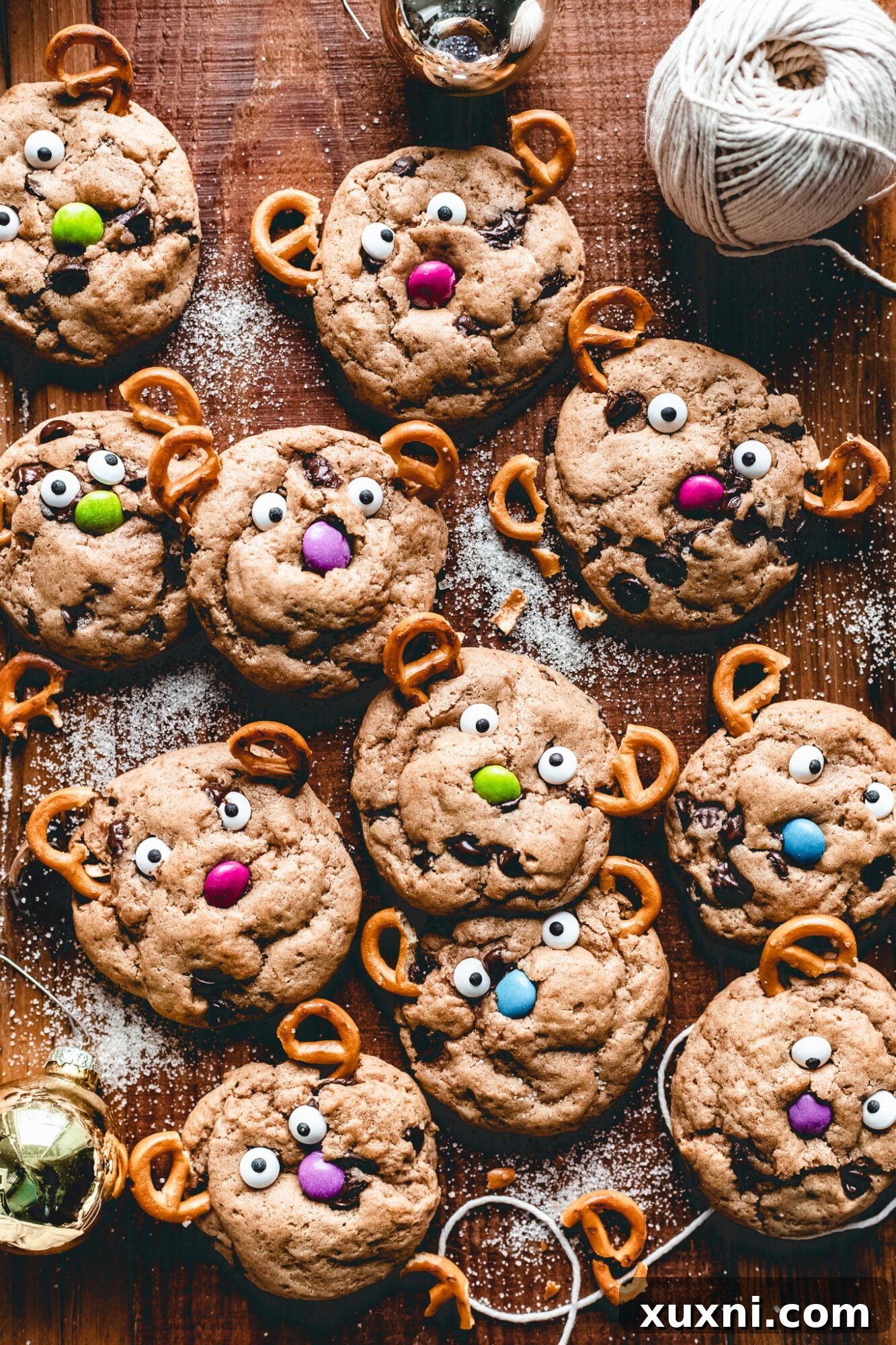 Whip Up Whimsical Reindeer Cookies 3 reindeer cookies on wooden board