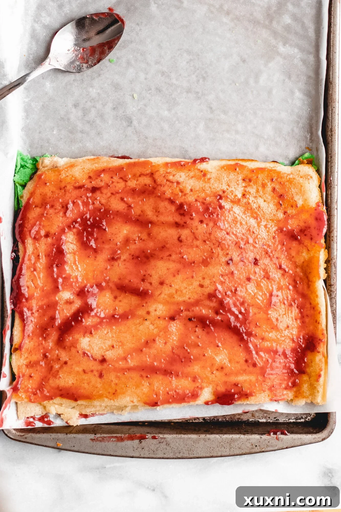 The second layer of tricolor cookie being placed.