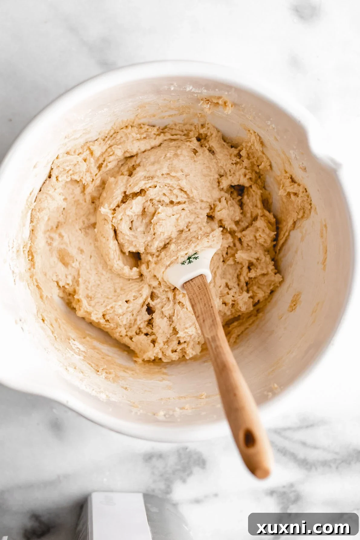 Vegan tricolor cookie batter in a mixing bowl.