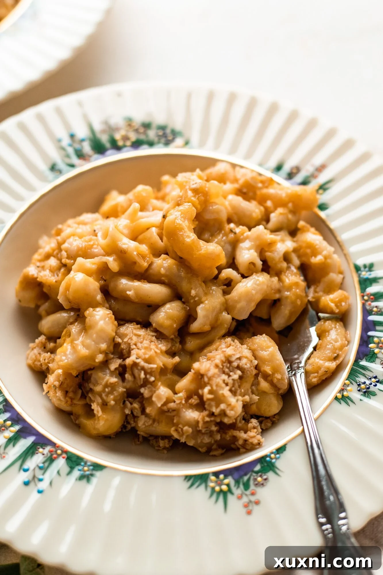 A freshly plated serving of baked vegan mac and cheese, ready to be enjoyed.