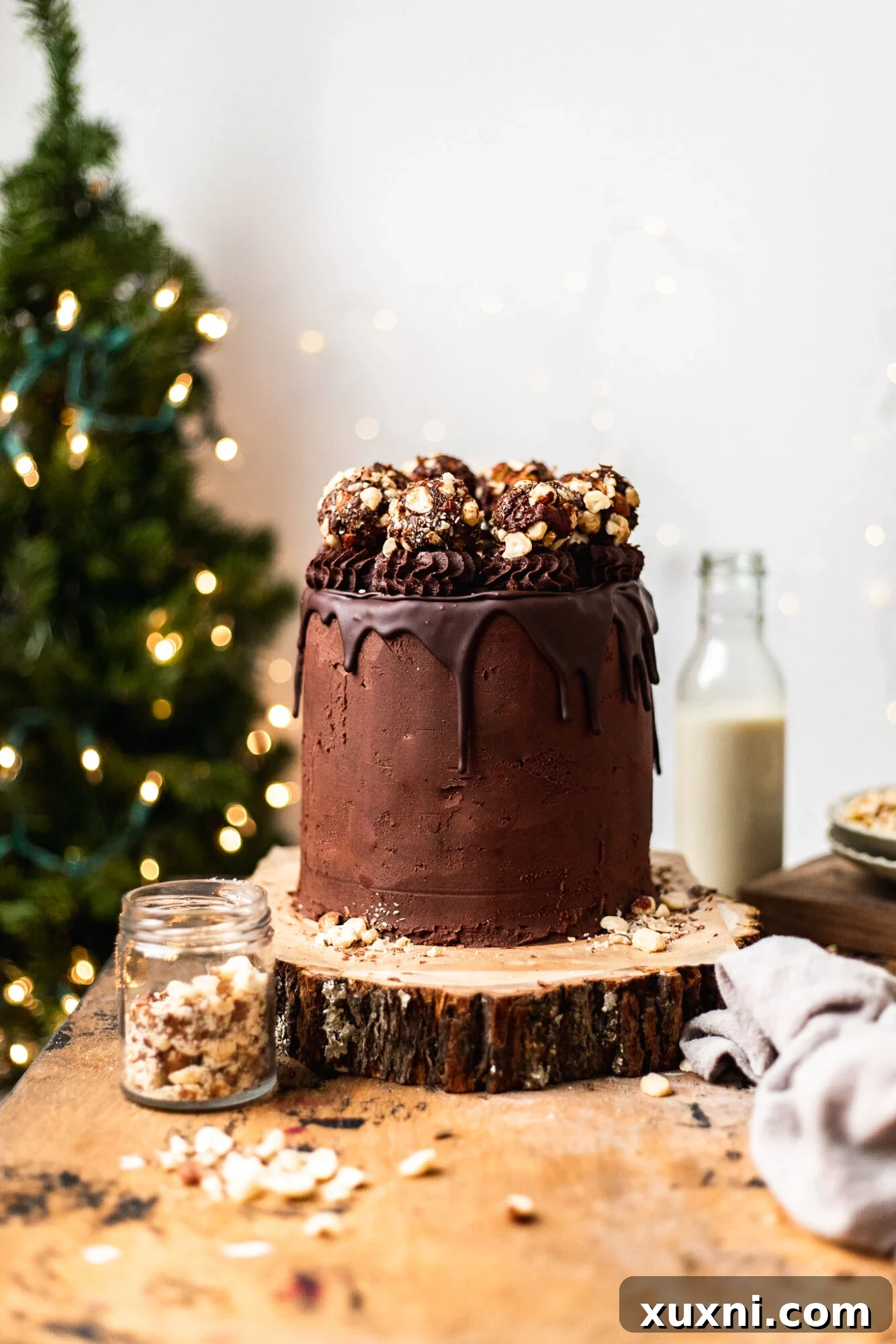 Decadent Vegan Chocolate Hazelnut Cake, reminiscent of Ferrero Rocher, topped with dairy-free Nutella buttercream.