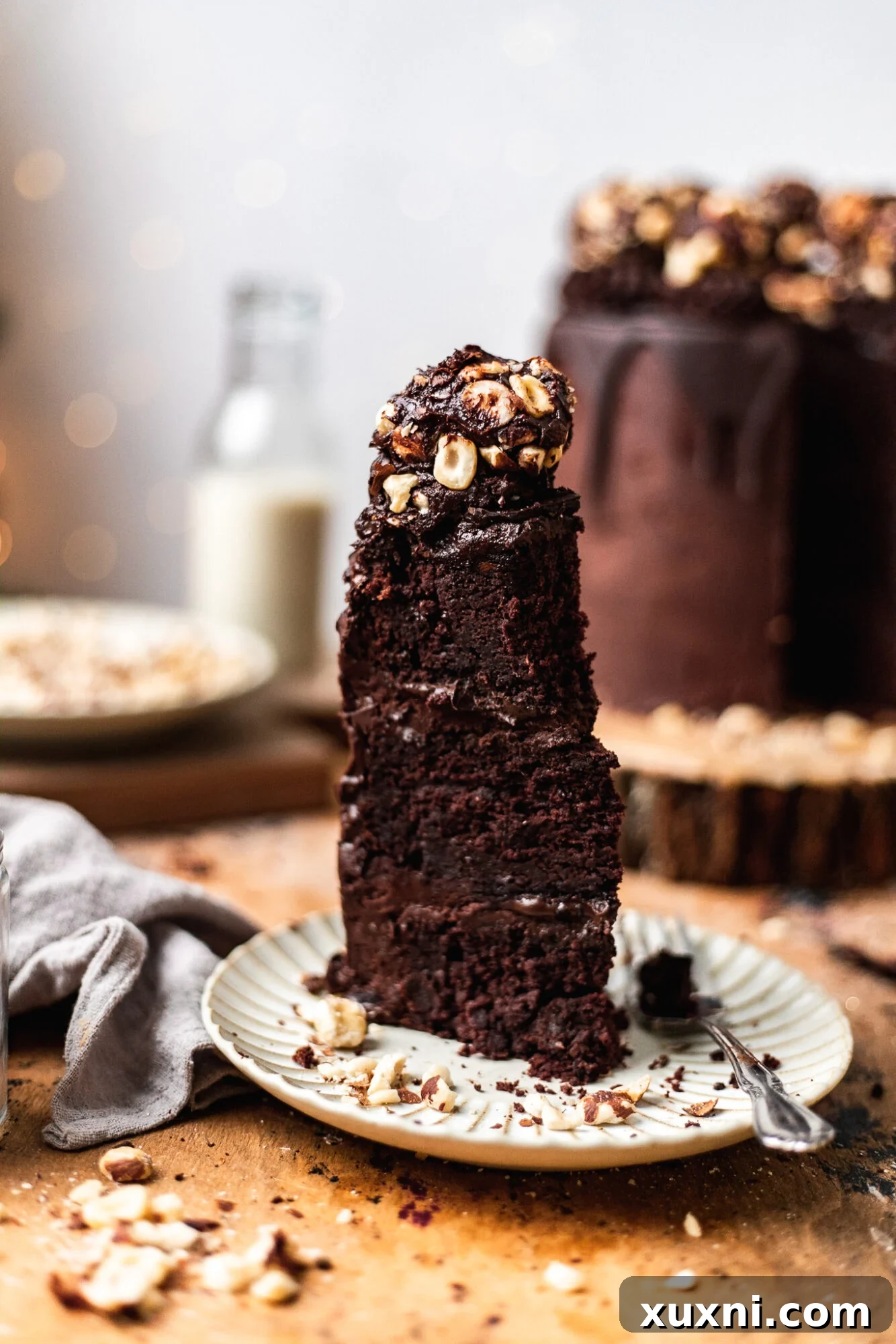 An exquisite vegan Ferrero Rocher inspired cake, showcasing its luxurious layers and rich chocolate finish.