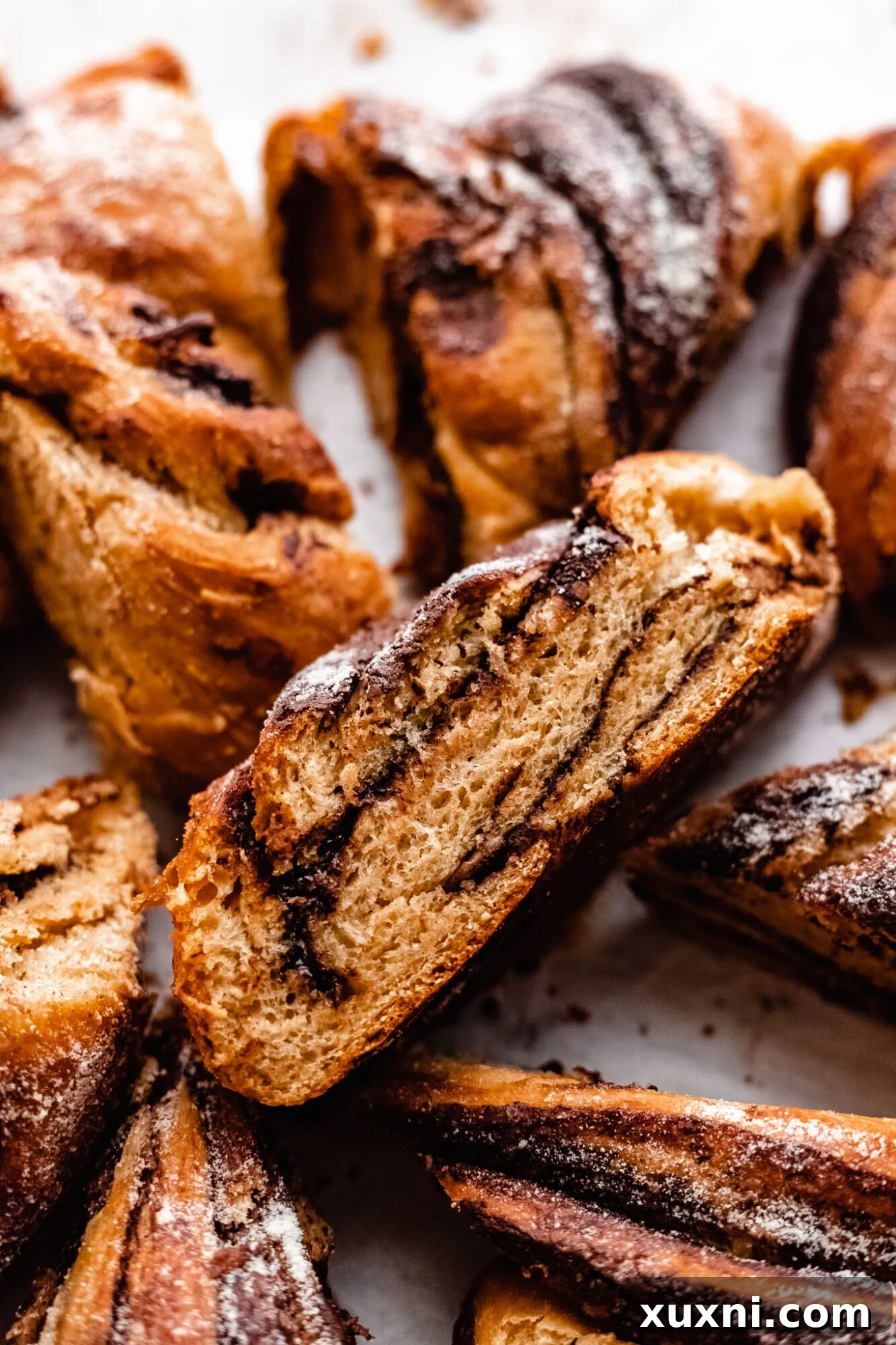A slice of sweet bread wreath revealing its delicious layers