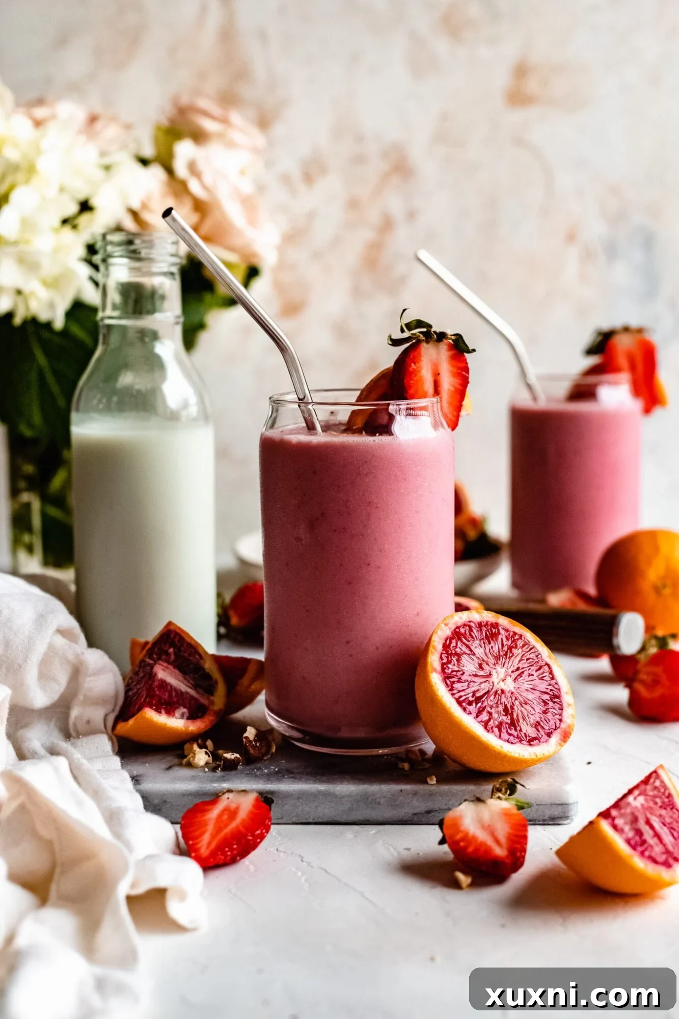 Vibrant Immune Boosting Strawberry Orange Smoothie (Protein Packed!) in a glass